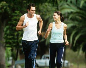 Sexy couple jogging after losing weight